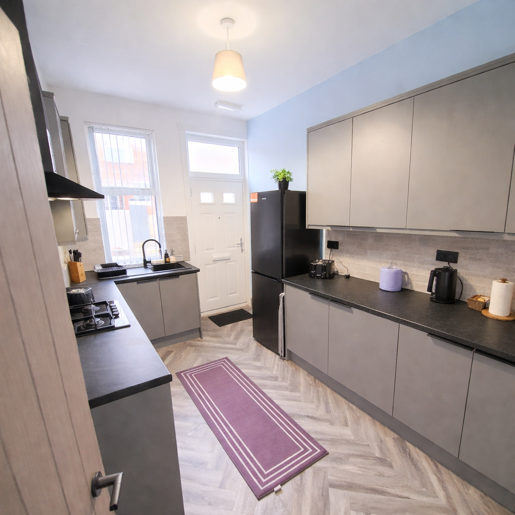 Modern galley kitchen with vibrant accents
